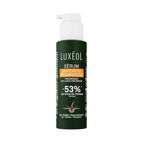 Sérum capillaire translucide de 100 ml posé sur une surface claire dans une salle de bain
