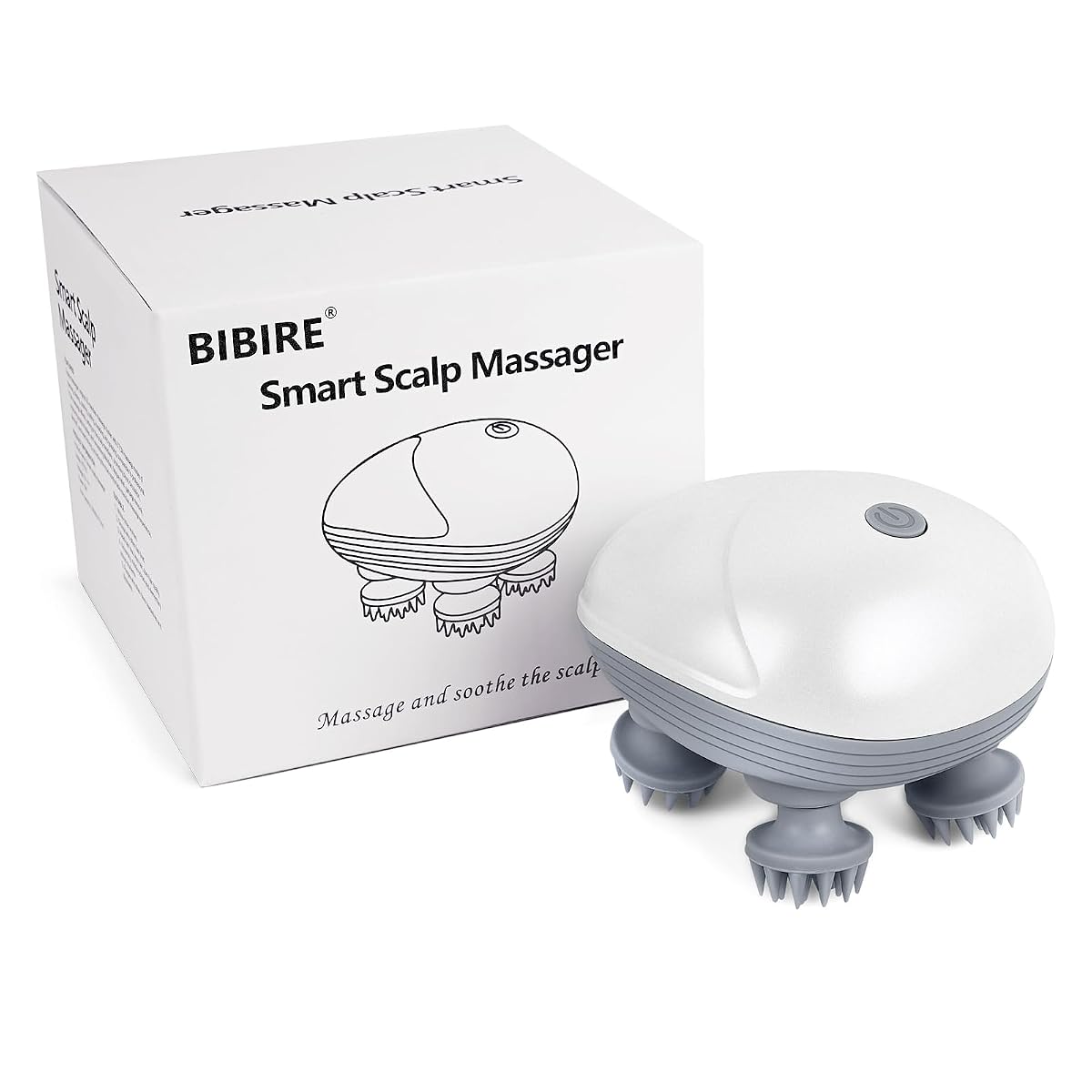 Masseur électrique de cuir chevelu blanc et gris à quatre têtes en silicone, posé sur une pierre claire.