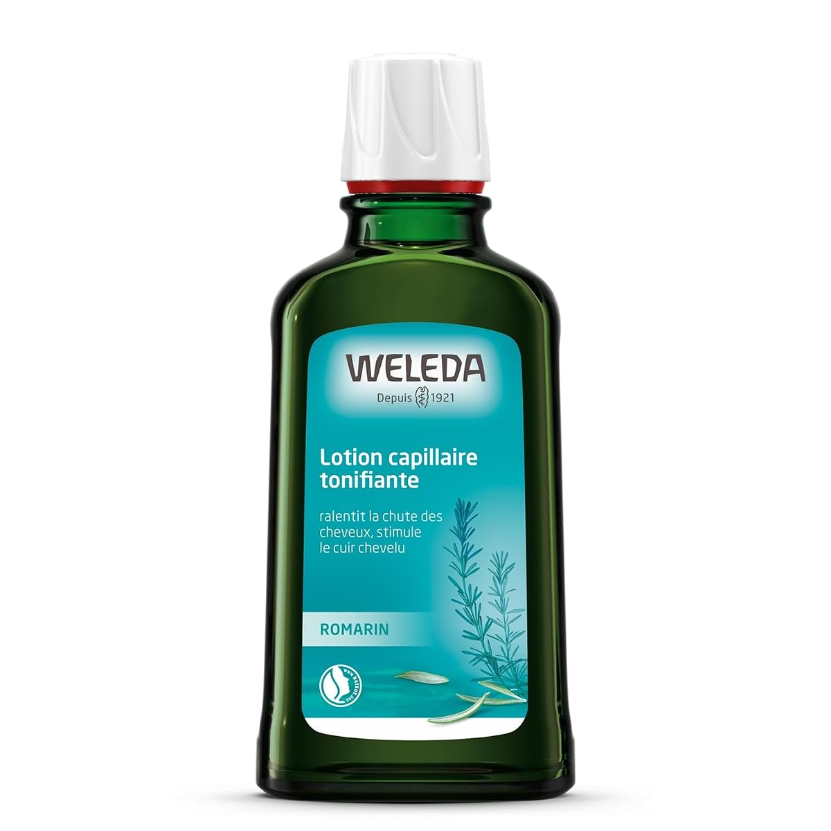 Flacon de lotion capillaire au romarin posé sur une surface en pierre claire dans une salle de bain