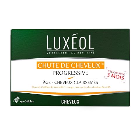 Boîte sobre de complément capillaire accompagnée de gélules sur une pierre claire
