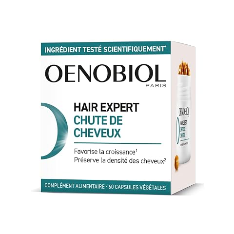 Complément capillaire Oenobiol en capsules présenté sur une surface de pierre claire.