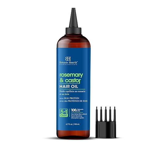 Flacon transparent d’huile capillaire avec applicateur peigne posé sur une pierre claire