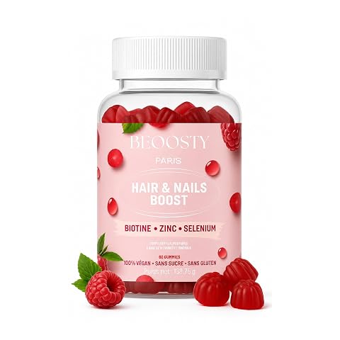 Soixante gummies à la framboise disposées en rangées sur une surface de pierre claire.