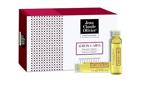 Douze ampoules capillaires multicolores alignées sur une pierre claire dans une salle de bain épurée